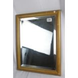 A vintage bevelled wall mirror, solid wood frame, 50 x 40 cm