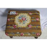 Upholstered footstool with tapestry floral design, turned wooden legs