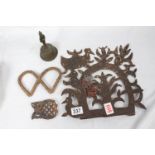 A lot: a collection of decorative ironwork including an antique brass bell; two pieces of studio