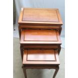 Nest of three tables, similar in style to lot 221