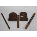 A pair of antique folding oak book ends with shield motif, a pair of antique thermometers and a