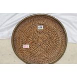 Brass edged woven bamboo hors d'oeuvres tray, 38cm diameter
