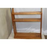 Freestanding pine bookcase, one shelf needs new supports, measures 100 (ht) x 86 x 23 cm