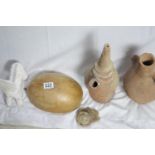 A lot: two old clay amphoras, ht 34 cm; a half gourd shell; an ammonite fossil; a white pottery