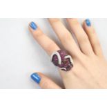 Skull ring with rubies and diamonds comprising 150 cut rubies, 120 diamonds: weight 34g. Confirmed