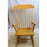 A spindleback rocking chair