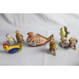 A collection of ceramic bird ornaments