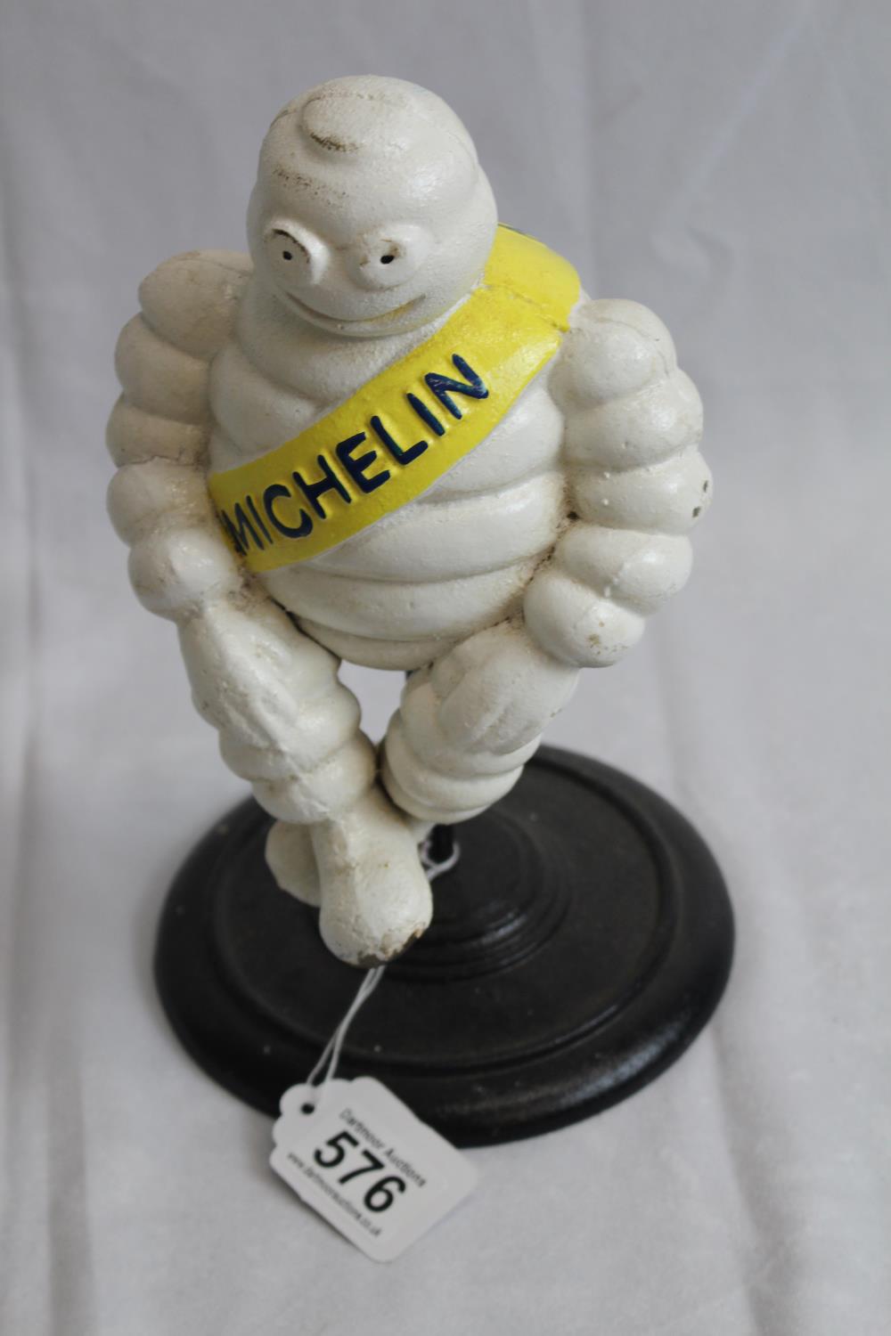 Cast iron revolving Michelin man