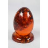 Amber egg on stand