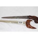 Oriental dagger with ornate handle and silver scabbard