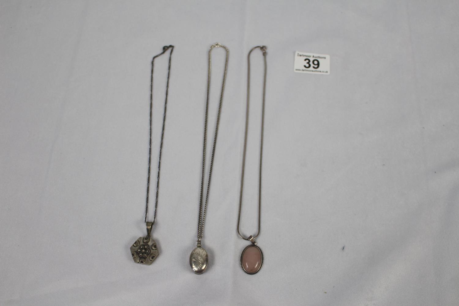 Three silver necklaces / pendants