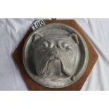 An original emblem from the HMS Bulldog depicting bulldog's head on wooden wall-hanging plaque, 55 x