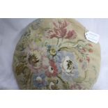 A round cushion with floral tapestry with velvet backed removable cover; a collection of sewing