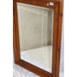 Modern pine framed wall mirror, with hanging wire, measures 93 x 69cm, very good condition