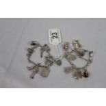 Pair of silver charm bracelets as found 59.4g