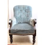 Beautiful 19thC buttonback armchair upholstered in blue velvet, scroll arms and legs on castors.