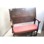 Oak two-seater settle, measures 112 (H) x 103cm (L) x 48 (D) cm, two plank back and balustraded