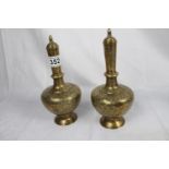 Two brass Islamic leaf design lidded vases