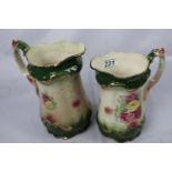 A graduated pair of antique floral transfer printed jugs