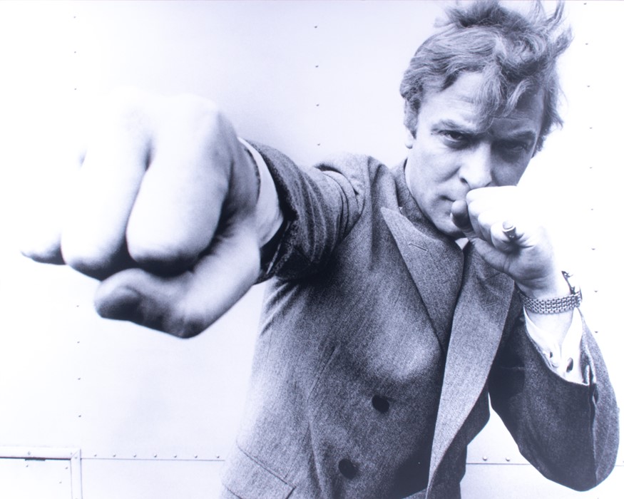 After Stephan C. Archetti (XX) "Michael Caine Packs a Punch" depicting Michael Caine in 1965,