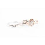 A 9ct rose and white gold and diamond ring set comprising of a crossover style cluster ring set with