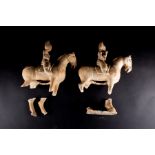 A pair of painted pottery figure of a horse and rider, possibly Tang Dynasty,  the seated riders