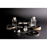 A matched silver and tortoiseshell dressing table set largely early 20th century, by William Comyns,