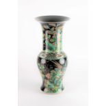 A Chinese Qing dynasty famille noire yen-yen vase probably late Kangxi period, decorated with