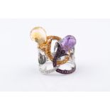 An unusual diamond and gemstone cocktail ring set with a faceted briolette-cut citrine and amethyst,