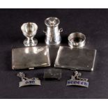 A mixed group of small silver items comprising two cigarette cases, a pepper modelled as a milk