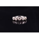 An 18ct white gold and old-cut stone diamond ring set with five old-cut diamonds of approximately