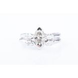 An unusual diamond double band ring centred with a marquise-cut diamond of approximately 0.45