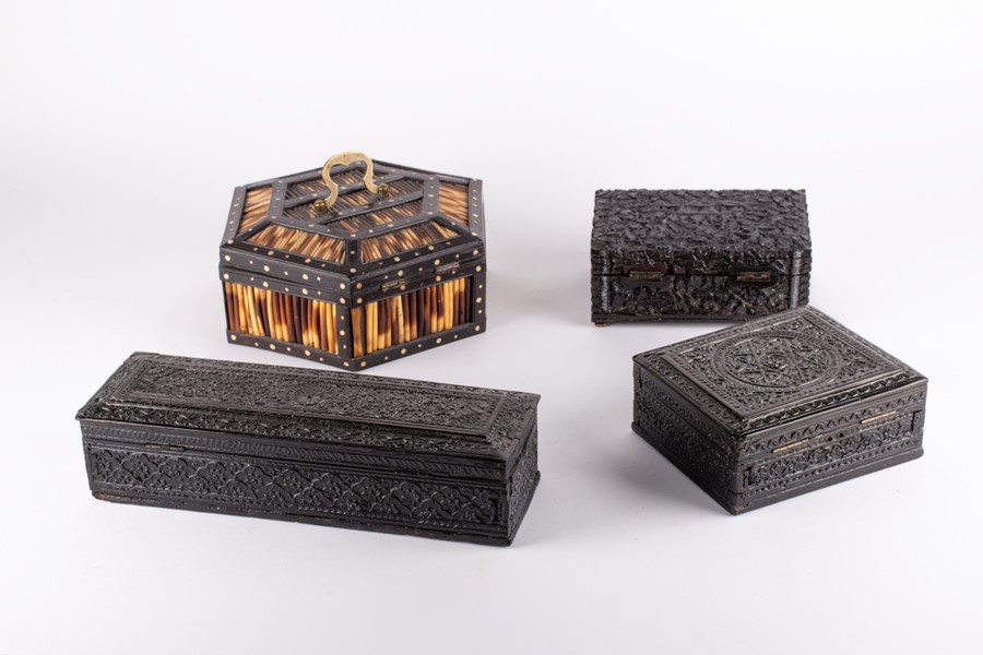 A small collection of Anglo-Indian ebony boxes to include a 19th century box profusely carved with
