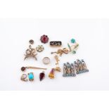 A group of various pieces of jewellery items including an opal and green garnet cluster, a turquoise