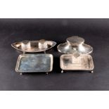 A George V silver capstan inkwell of elongated oval form Birmingham 1915, (maker indistinct), 19.5