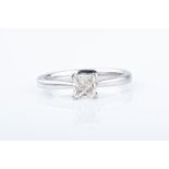 A platinum and diamond ring set with a princess-cut diamond of approximately 0.45 carats,