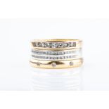 An 18ct yellow gold and diamond eternity ring scatter-set with small diamonds, size L, together with