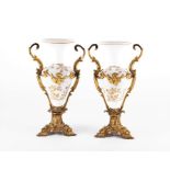 A pair of 19th century ormolu mounted opaline vases each designed with a flared gilt rim, the body