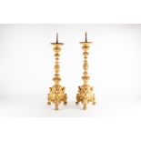 A pair of 19th century giltwood pricket candlesticks decorated with acanthus leaves and laurel