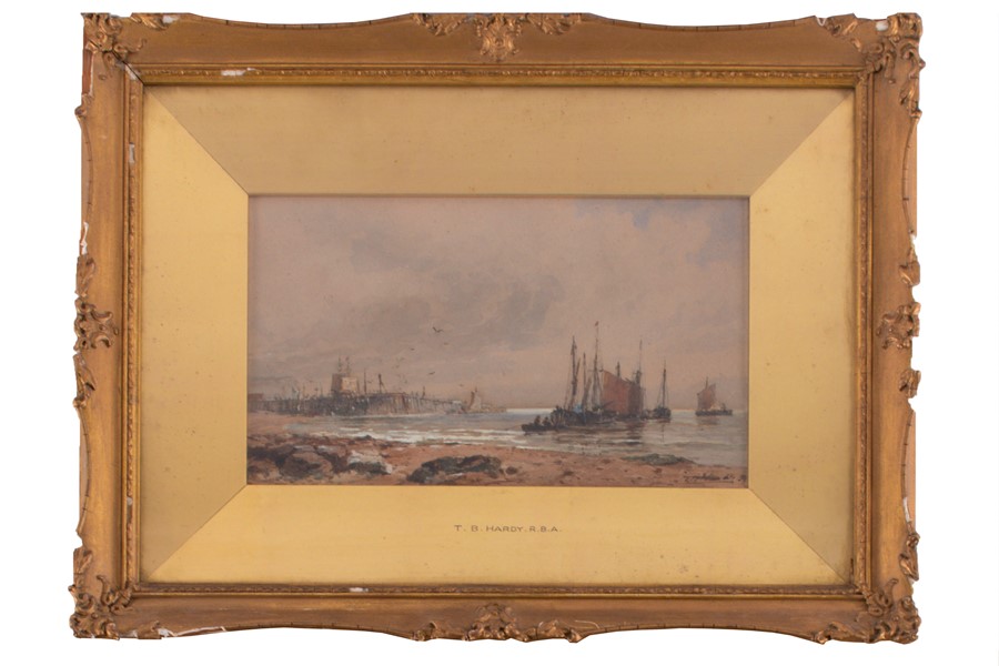Thomas Bush Hardy RBA (1842-1897) British depicting boats on the beach with a pier in the