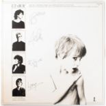 U2: a 1981 'Boy' LP signed to the back cover by Bono, Adam Clayton, The Edge and Larry Mullen.