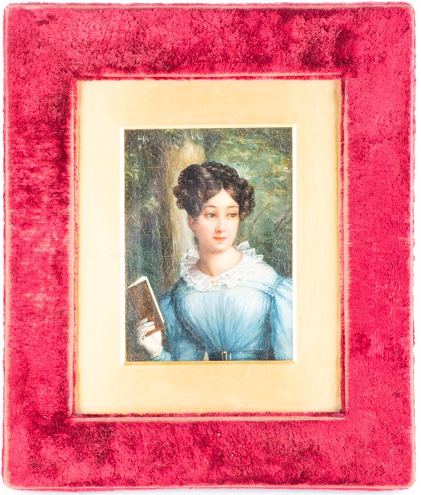 English School, 19th century depicting a portrait of a young lady reading, unsigned, oil on canvas