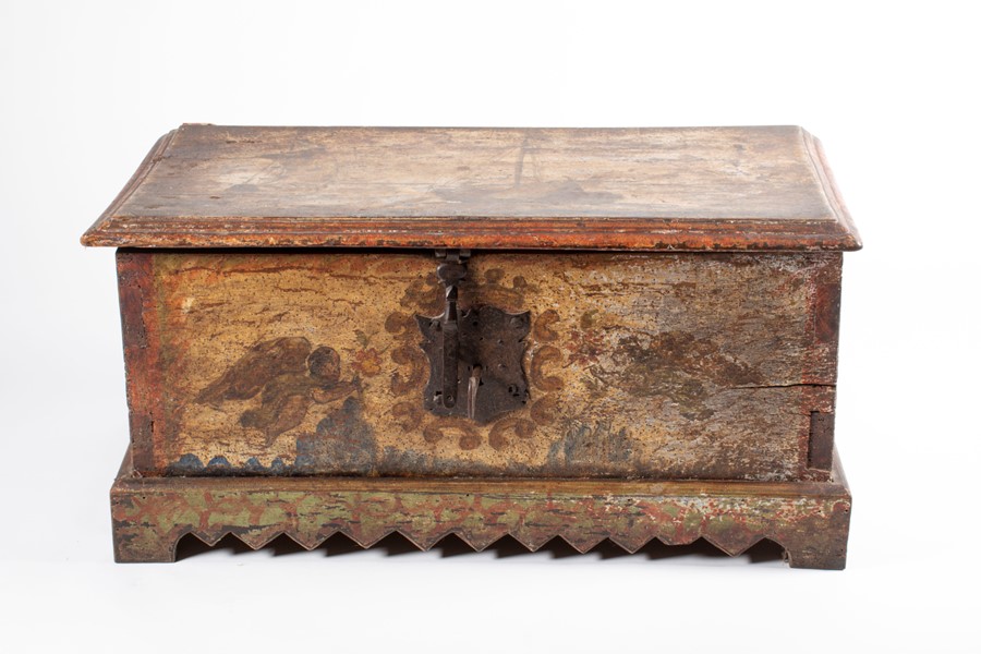 An early 18th century painted trunk with cast iron mounts and key, decorated to the outer and