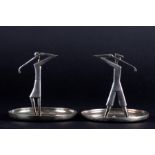 Franz Hagenauer: A pair of Art Deco white metal pin trays designed as a male and female golfer in