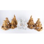 A set of six 19th century Continental blanc de chine figurines together with six conforming giltwood