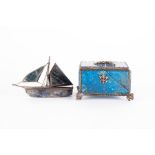 A miniature carved labradorite and white metal model of an Arabian Dhow approx. 10 cm long x 6.5