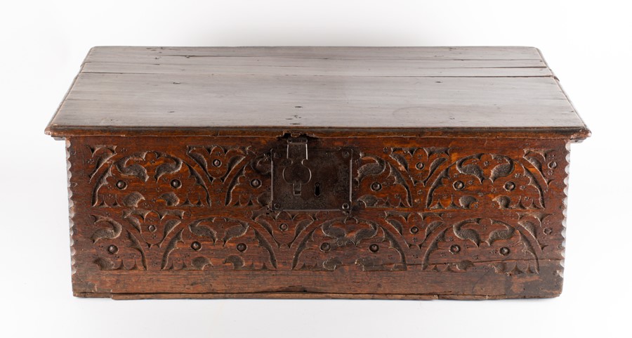 An 18th century oak bible box  of typical form, with carved decoration, 72 cm x  45 cm x 25 cm.
