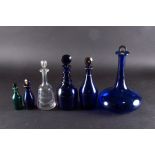 A group of six 19th century glass decanters and cruet bottles including a 'Bristol' blue Rum