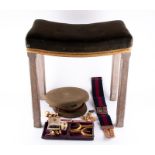 A limed oak George VI Coronation stool with upholstered seat finished with gold braid, 47 cm high