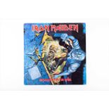 Iron Maiden: a signed 'No Prayer for the Dying' LP the cover with three band signatures, obtained in